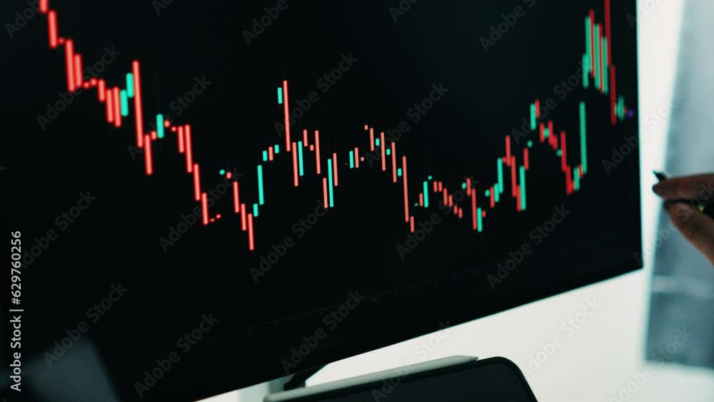 Aufkleber Back view of stock market broker in analyzing data and graphs on multiple computer screens while sitting in modern office.
