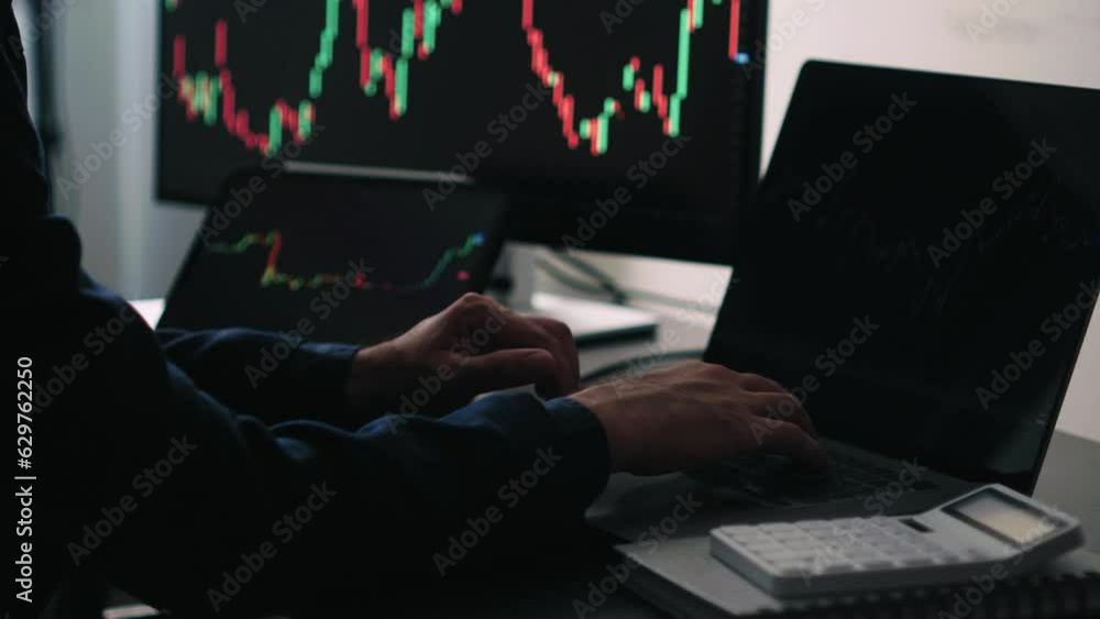 Aufkleber Back view of stock market broker in analyzing data and graphs on multiple computer screens while sitting in modern office.