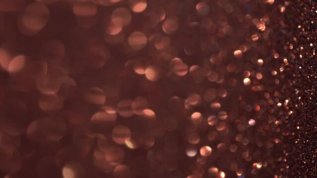 Shiny copper surface rotates. Magic bokeh vertical background