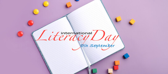 Banner for International Literacy Day with notebook