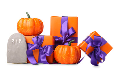 Composition with pumpkins, gift boxes and tasty cookie for Halloween on white background