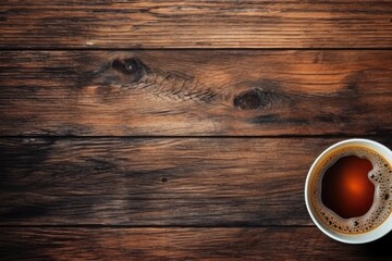 A cup of steaming coffee on a rustic wooden table