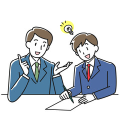 男性講師の個別指導をうける笑顔の男子学生