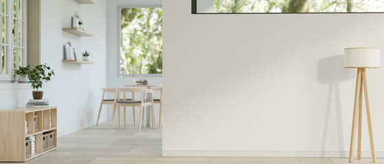 A minimalist white room with a minimal floor lamp, empty space on the white wall © bongkarn
