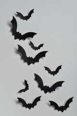 Paper bats for Halloween party on blue background