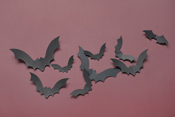 Paper bats for Halloween party on brown background