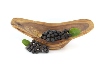 Bunch of aronia berries with green leaf on white