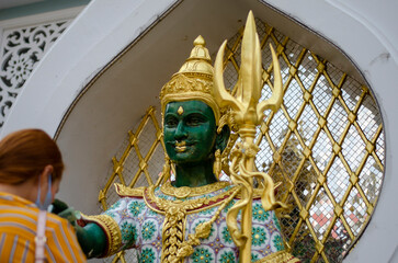 Bangkok, Thailand - April 22, 2023: Devaraj Neramit or Thep Tanjai statue, Thewarat Kunchorn...