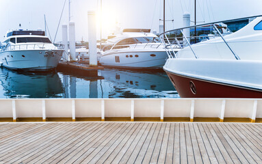 Background of pier with yachts and wood platform