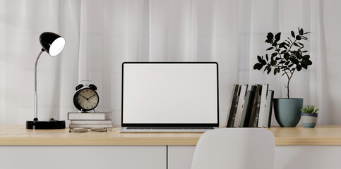 Home office desk workspace. White blank screen monitor on modern working desk. Equipment on table. Modern office concept.