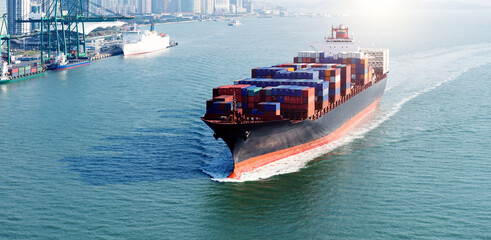 Large cargo container ship arriving in port