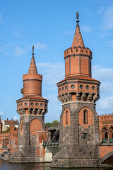 Fototapeta na wymiar The towers of the beautiful Oberbaumbruecke in Berlin on a sunny day