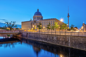 The rebuilt Berlin City Palace and the famous TV Tower dring the blue hour