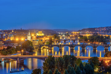The bridges over the river Vltava in Prague at night at dusk
