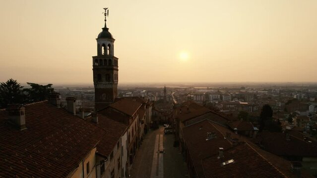 Old Town in Northern Italy at Sunrise. The old medieval buildings are lit by the first light of the day.