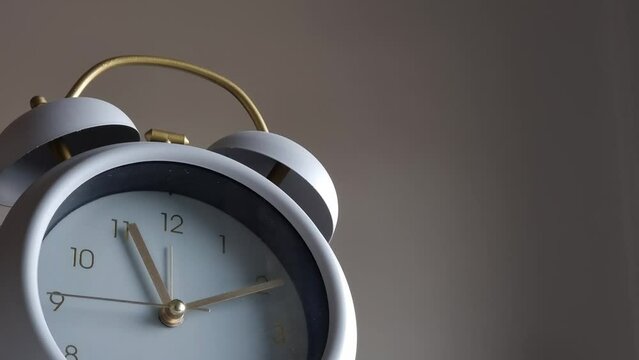 Close up modern wall clock with running time pointer.