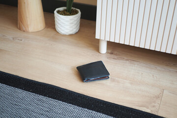  left wallet on floor at home 