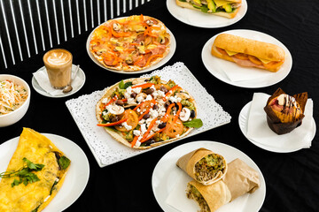 A Variety of Cafe Menu Delights Gracefully Arranged on The Dining Table