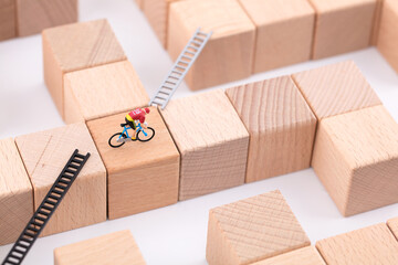Miniature photography cycling on a maze of building blocks
