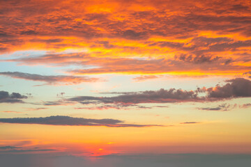 Dramatic sunrise against a sky with colorful clouds.  Real sunset, dawn. Without any birds. This is real dawn cloudscape
