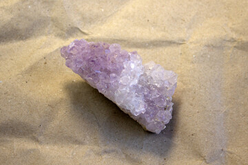 Set of various amethyst natural mineral stones and gemstones on grey background