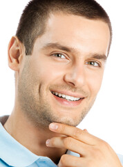 Obraz premium Cheerful thinking young man, isolated over white background