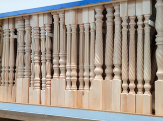 Balusters in the store. Shopping for baluster in DIY shop. Carved balusters for the wooden...