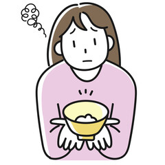 ダイエットのためにご飯を減らして不満顔の若い女性