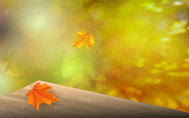 Naklejka na ściany i meble Wooden table corner perspective view on autumn orange blurred background. 