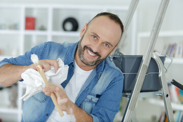 senior man painting at home © auremar