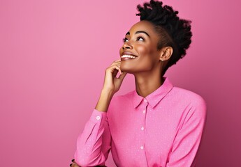 Portrait of a young woman in a pink shirt looking to the side and thinking, isolated on pink studio background. - Powered by Adobe