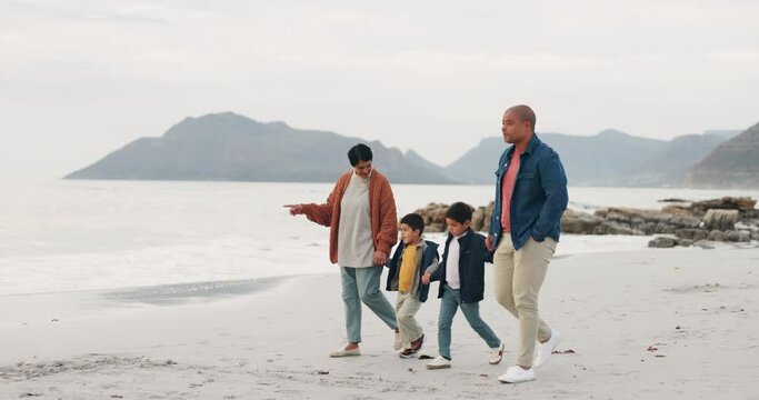 Grandmother, father and kids walking on beach, holding hands and travel by the ocean, trust and bonding outdoor. Winter, nature and people on adventure, family and freedom on journey with love