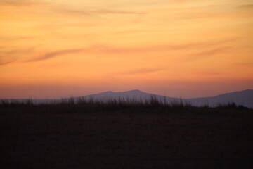 Red sunset and mountains silhouette