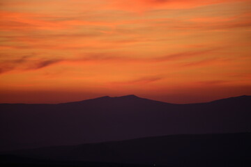 Red sunset and mountains silhouette