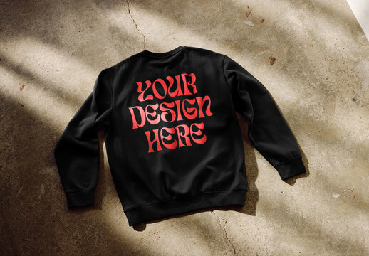 Mockup of long sleeve top with customizable color laying on floor