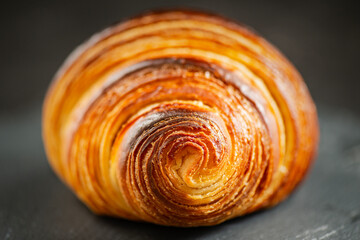 Detailed close-up of crispy, flaky, and delicious butter croissant