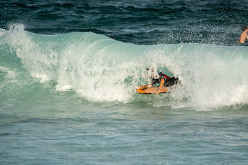 body border getting a barrel at the beach