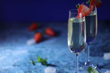 Two glasses of champagne with strawberry