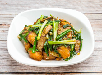 steam fish brisket with ginger and spring onions served in dish isolated on wooden table top view hong kong food