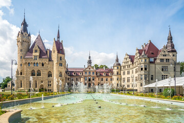 View at the Moszna castle with fountain in Poland - 629834001