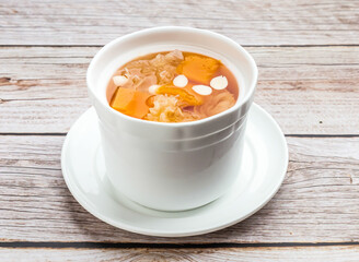stewed papaya with silver fungus served in dish isolated on wooden table top view hong kong food
