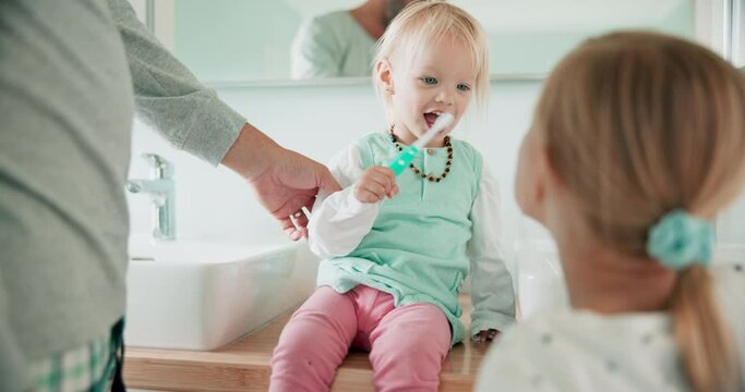 Father, children and brushing teeth in bathroom for dental wellness, morning routine or teaching healthy habits. Family, dad and girl kids cleaning mouth with toothbrush for self care of fresh breath
