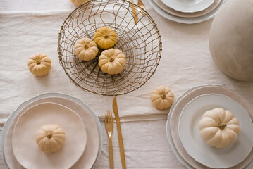 Fototapeta na wymiar Autumn table setting with pumpkins. Decor about Thanksgiving