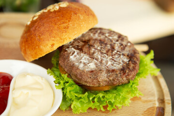 Hamburgers on a wooden tray