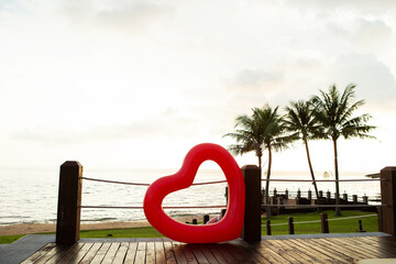 Heart lifebuoy on the beach