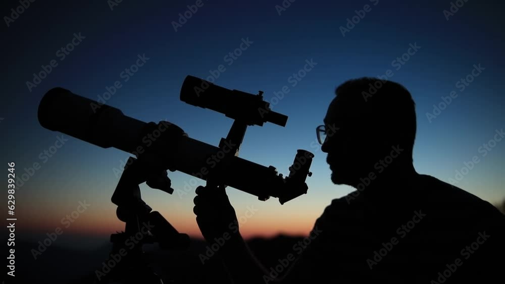 Canvas Prints astronomer looking at the starry skies and crescent moon with a telescope.