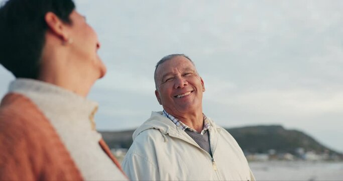 Old couple, happiness and retirement together at beach, travel and freedom with smile outdoor. Trust, love and care with happy people and pension, holiday and marriage, commitment and life partner