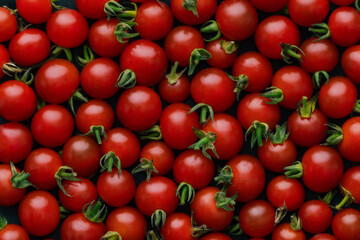 Closeup view on red charry tomatoes background. Vegetable backdrop