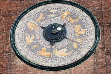 Fototapeta na wymiar Clock on the Medieval Bell Tower of Cremona known as the Torrazzo, Lombardy, Italy.