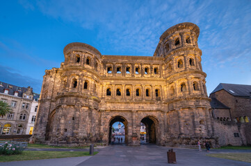 View of the Porta Nigra,at sunset,  a Roman City Gate built after 170 AD and located in Trier, Germany - obrazy, fototapety, plakaty